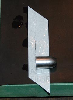 Bullet is placed on the wet patch with its base on the internal dotted line.