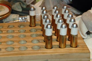 Bullets perched on case mouths.